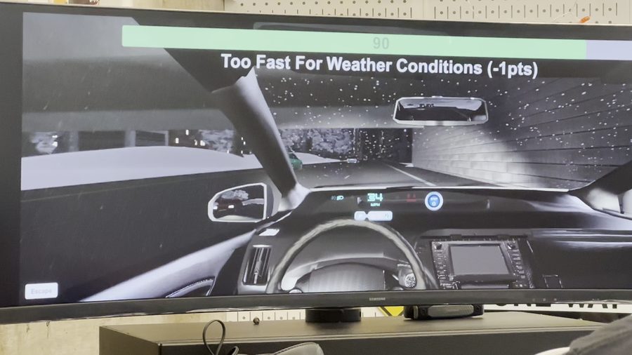 Simulator screen showing a weather-driving feedback prompt